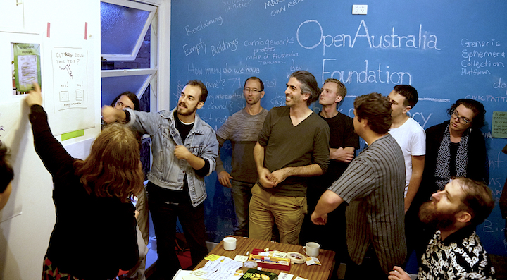 Photograph of people of The OpenAustralia Foundation team and contributors redesigning street development notices at the Frontyard Hackfest 2016